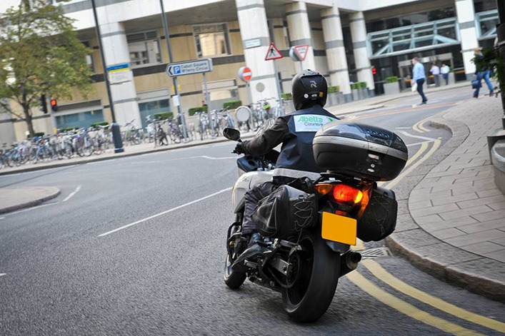 Motorcycle Courier Heading To Urgent Delivery